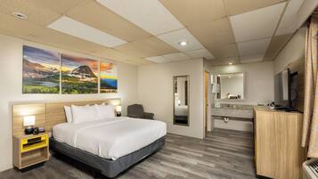 Desk, laptop workspace, iron/ironing board, free cribs/infant beds