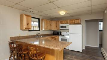 Suite, 2 Queen Beds, Non Smoking | Desk, laptop workspace, iron/ironing board, free cots/infant beds