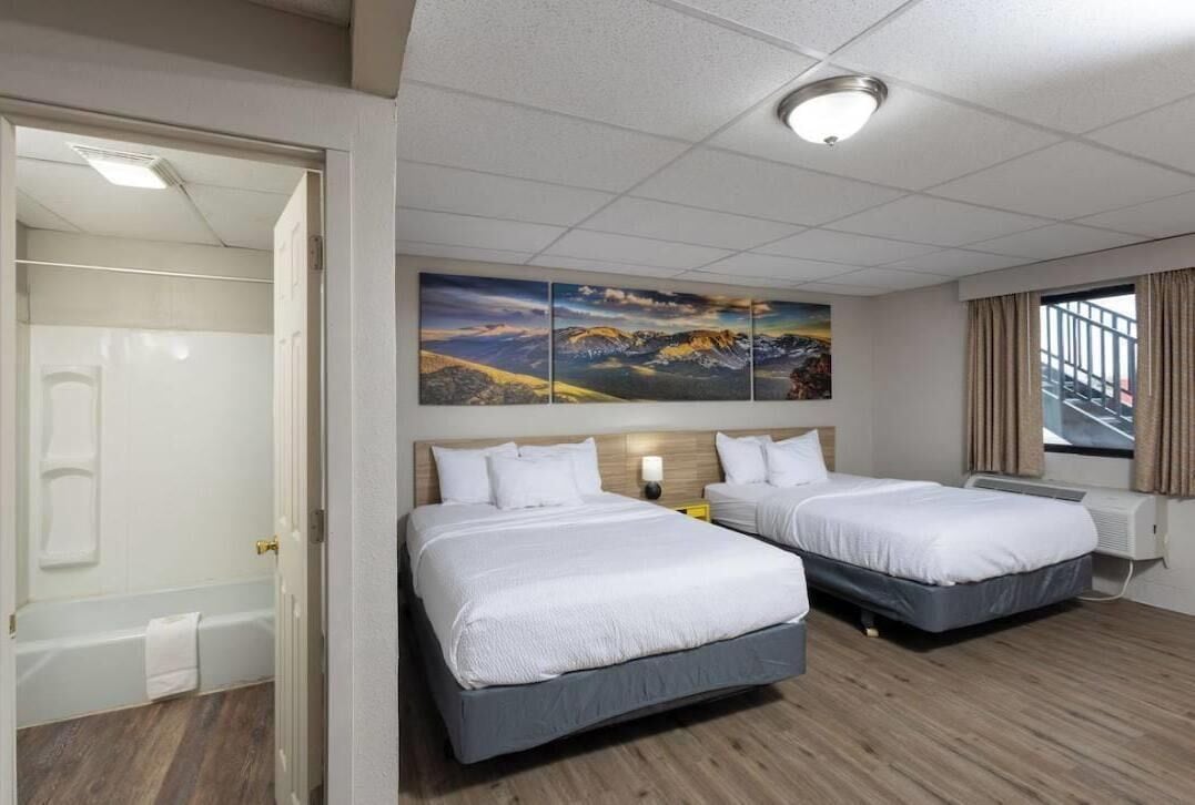 Room, 2 Queen Beds, Non Smoking (Pet-friendly) | Desk, laptop workspace, iron/ironing board, free cribs/infant beds