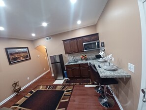 Fridge, microwave, stovetop, coffee/tea maker