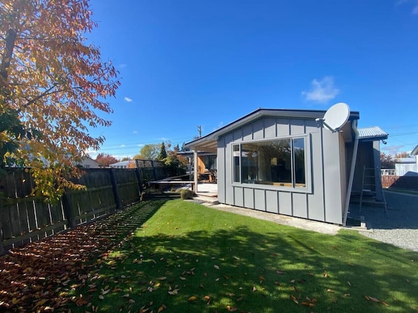 Situated in a serene setting, this single-story building offers a peaceful atmosphere with large windows and a well-manicured lawn.