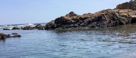 A rocky coastline with clear water.