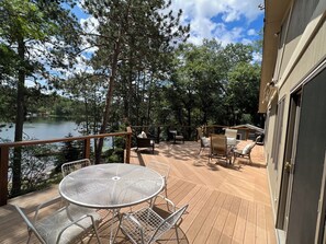 Outdoor dining - Spacious lakefront cabin on beautiful sand bottom Leader Lake. (Minong)