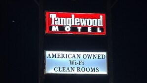 A motel sign with "Tanglewood Motel" and "American Owned Wi-Fi Clean Rooms" text. - Tanglewood Motel (Frederick)
