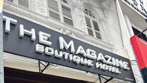 A boutique hotel with a prominent sign reading "THE MAGAZINE BOUTIQUE HOTEL". - The Magazine Boutique Hotel (George Town)