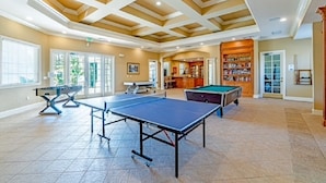 A spacious indoor area with a ping pong table, a pool table, and a billiards table. - 12-208 Legacy Dunes resort, Kissimmee, balcony, heated swimming pool, gym  (Kissimmee)