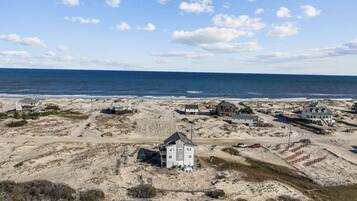 On the beach, sun-loungers, beach towels