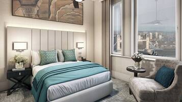 A modern hotel room with a large bed, a city view, a small side table, and a comfortable armchair.