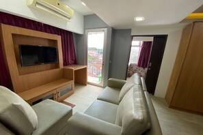 Apartment, 2 Bedrooms | Living area | 32-inch LCD TV with cable channels, TV