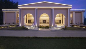 A large, well-lit building with a grand entrance, multiple arches, and a symmetrical facade. - Clarks Resort Birgunj (Birgunj)