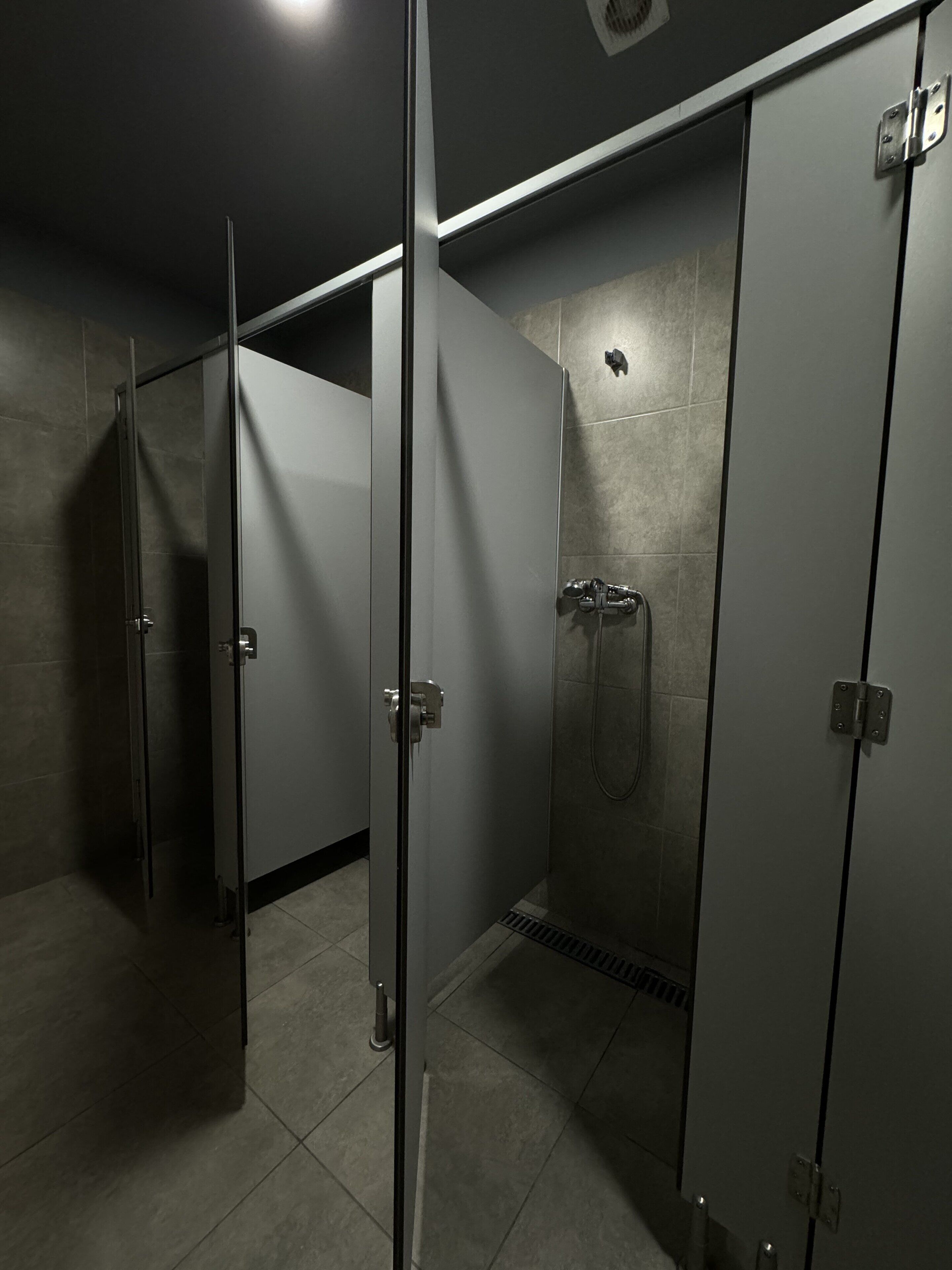 Shower, hair dryer, soap, toilet paper