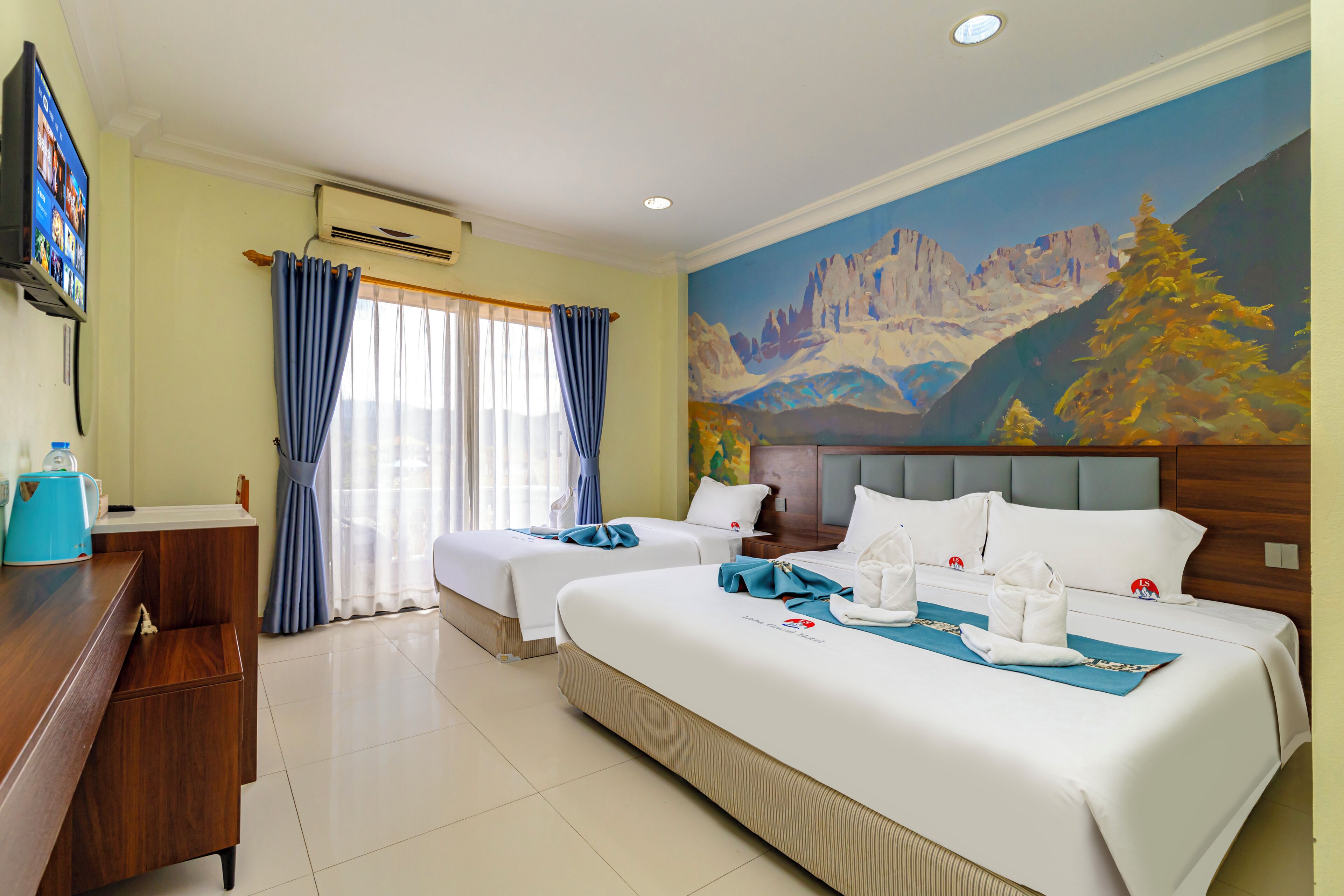 Hypo-allergenic bedding, desk, laptop workspace, blackout curtains