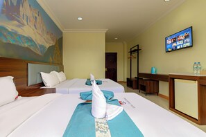 A hotel room with two beds, a television on the wall, and a painting on the wall. - Lisha roungnakhone hotel (Vang Vieng)