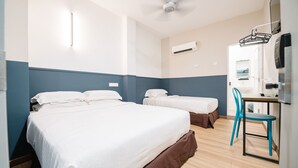 A hotel room with two beds, a desk, a chair, an air conditioning unit, and a ceiling fan. - The Concept Hotel KL - Batu Caves (Batu Caves)