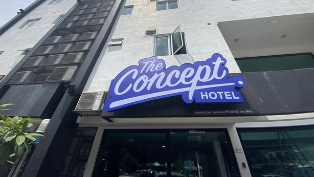 The Concept Hotel with a modern facade, large windows, and a prominent blue sign. - The Concept Hotel KL - Batu Caves (Batu Caves)