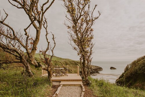 Coastal Magnificence: Saltwater Chronicles with private sea view deck.