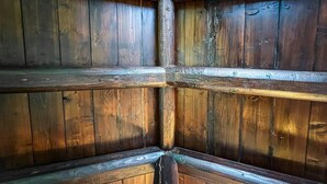 A wooden interior with a grid-like structure of beams and panels. - Housing of Charme With Rooftops Balconies (Galatone)