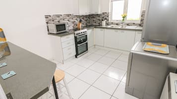 Fridge, electric kettle, toaster, cookware/dishes/utensils