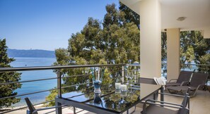 Outdoor dining - luxury apartment waterfront with amazing sea view (Karavomylos)