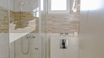 Shower, free toiletries, hair dryer, slippers