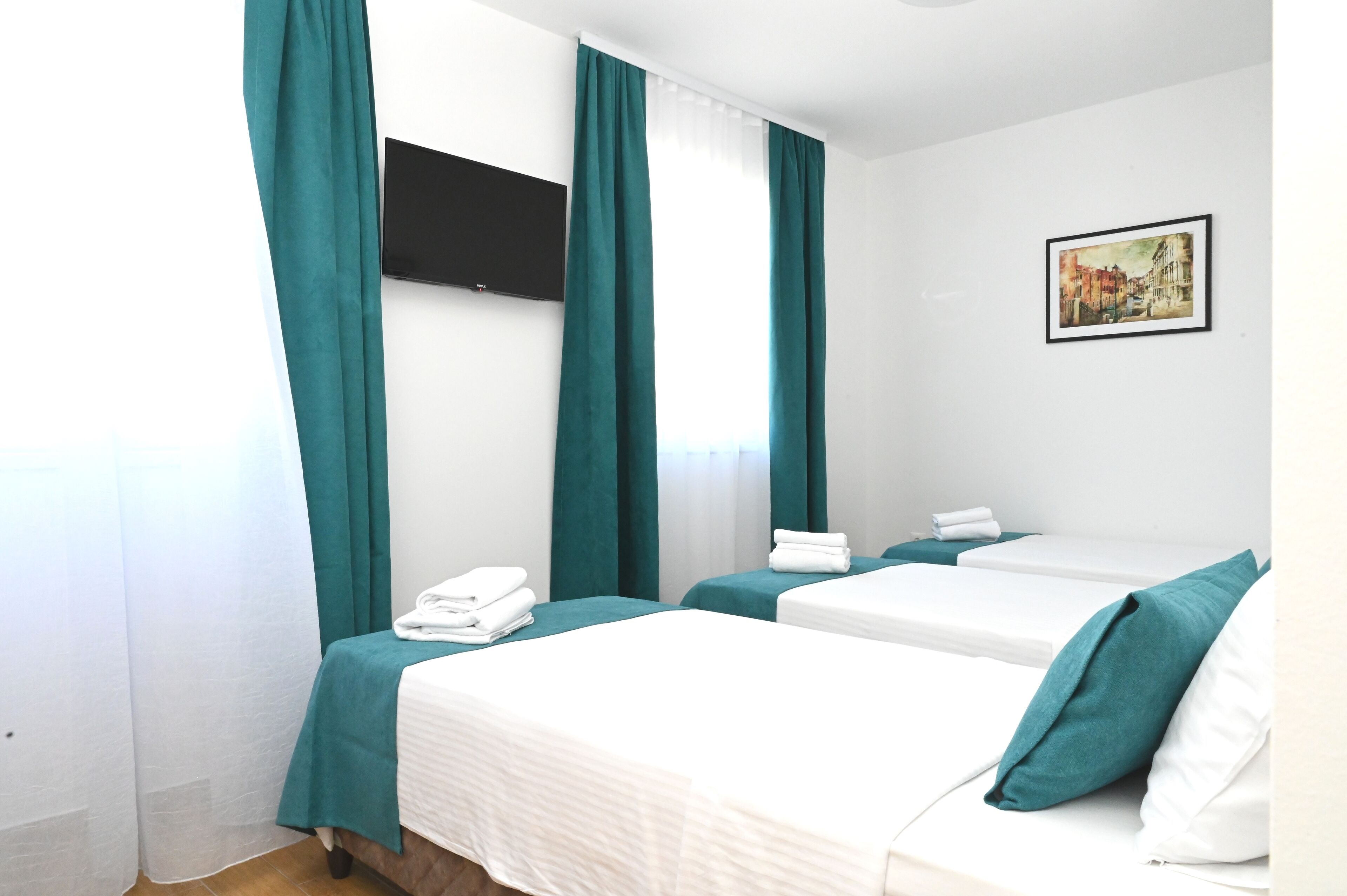 Classic Room, 3 Twin Beds | Desk, laptop workspace, blackout drapes, iron/ironing board (on request)