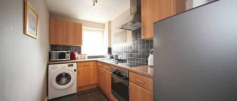 Apartment | Private kitchen | Fridge, microwave, oven, stovetop