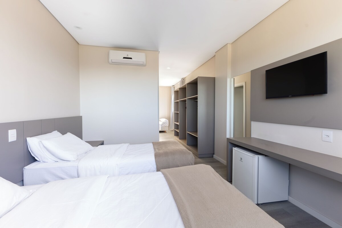 Deluxe Triple Room | Minibar, desk, laptop workspace, soundproofing
