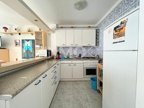 Fridge, microwave, coffee/tea maker, cookware/dishes/utensils