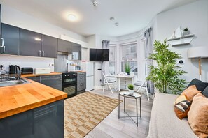 Premier Apartment, 1 Double Bed with Sofa bed | Living area | 40-inch LCD TV with digital channels