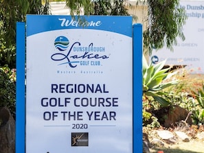 A sign for Dunsborough Lakes Golf Club announcing it as the Regional Golf Course of the Year for 2020.