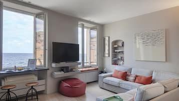 Apartment, 1 Bedroom | Living area | 35-inch flat-screen TV with digital channels, TV