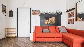 Apartment, 1 Bedroom | Living area | 35-inch TV with satellite channels