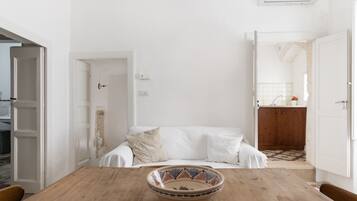 Apartment, 1 Bedroom | Living area | 35-inch flat-screen TV with digital channels, TV