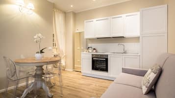 Apartment, 1 Bedroom | Living area | 35-inch flat-screen TV with digital channels, TV