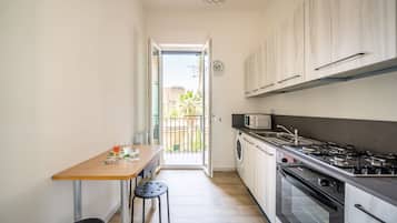 Apartment | Private kitchen | Espresso maker, full-sized fridge, microwave, oven