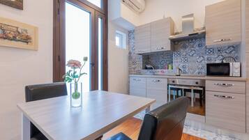 Apartment | Private kitchen | Full-size fridge, microwave, stovetop, electric kettle