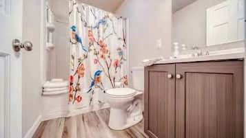 Bathtub, hair dryer, towels