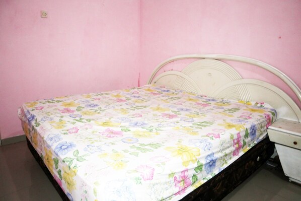 Laptop workspace, bed sheets