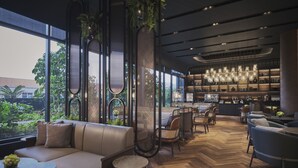 A modern interior with a large window, a bar area, and seating arrangements. - Pullman Singapore Hill Street (Singapore)