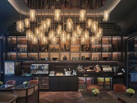 A bar area with hanging lights, shelves with bottles, and a bar counter.