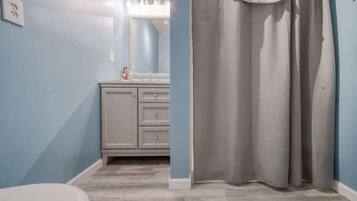 Bathtub, hair dryer, towels