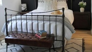 A bedroom with a bed, bedside tables, a bench, and a ceiling fan. - Casita dos Robles Fallbrook's Favorite Dog-friendly Country Escape (Fallbrook)