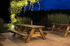 Outdoor dining - Charming home with large backyard, firepit, grill, patio, and private W/D (Petoskey)