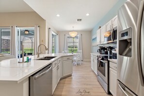 Fridge, microwave, oven, stovetop - New 5 Bedroom 5 Bathroom, Saltwater Pool with Free Heat, 3 miles to Disney (Kissimmee)