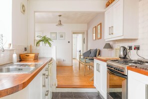 Fridge, microwave, oven, stovetop - Furlong Place is a three bedroom, family-friendly, centrally located holiday home in Whitstable. (Whitstable)