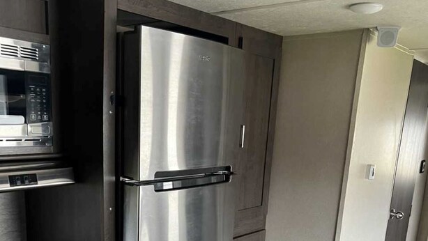 A modern kitchen with stainless steel appliances, a built-in oven, and a microwave. - Lake St Clair Waterfront (Chesterfield)