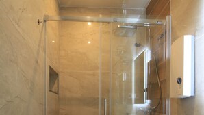 A modern bathroom with a glass-enclosed shower, a toilet, and a wooden vanity. - Asia Dreieck Pension Zimmer (Lauterecken)