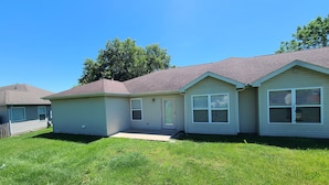 A single-story house with a front porch and a small attached garage. - Heart of Branson #2 (Branson)