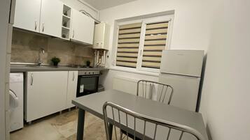 Fridge, coffee/tea maker, cookware/dishes/utensils