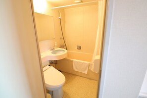 A bathroom with a toilet, sink, and bathtub.